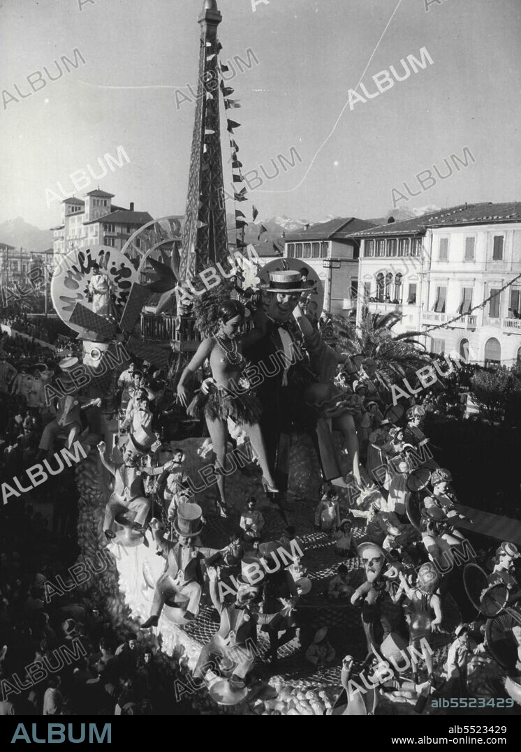 Moulin Rouge in Viareggio Carnival - A Tableau Depicting the Moulin Rouge with Josephine Baker and Maurice Chevalier, Built by Aloeo, in the procession, February 1st.The ephemeral personalities of Glue and paper which each year form theprocession of trailers along the sea front of the Italian seaside resort ofViareggio, broke loose, February 1 when the 1953 carnival opened.Eight Gigantic Trailers bearing huge paper puppets were cheered by a large crowd. Theme of this year's Carnival is "The Carnival Throughout The Ages". February 18, 1953. (Photo by Associated Press Photo).