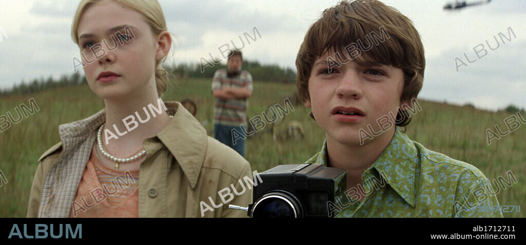 ELLE FANNING and JOEL COURTNEY in SUPER 8, 2011, directed by J. J. ABRAMS. Copyright PARAMOUNT PICTURES.