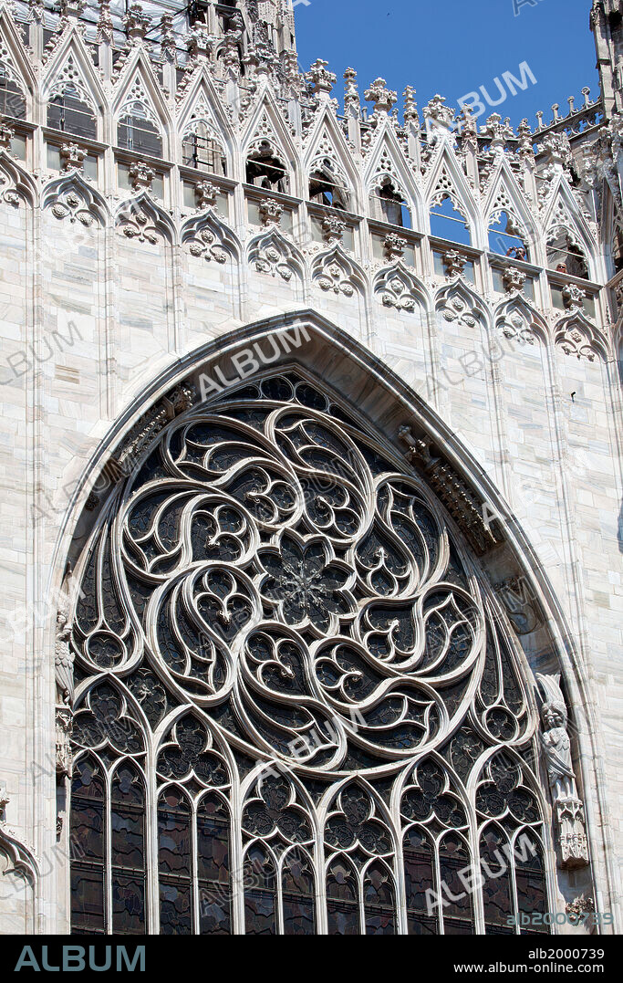 Italy, Milan, Milan Cathedral, Rose Window. Three large windows, one of which are seen in the picture, is divided by narrow ribs into twelve slender lancets culminating above in the tracery of the rose windows. Its so elegant with the beautiful geometrical composition. Designed by Nicolo di Bonaventura and Filipino degi Organi da Modena, between 1390 and 1402.