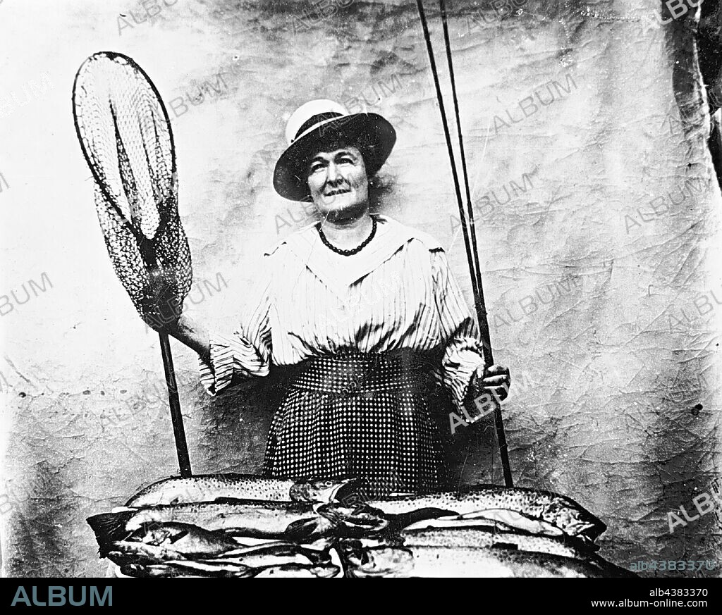 Negative - Woman With a Fishing Rod & Net Displaying her Catch From Lake  Wendouree, Ballarat, Victoria, 1920, A woman with a fishing rod and net  displaying a large catch o - Album alb4383370