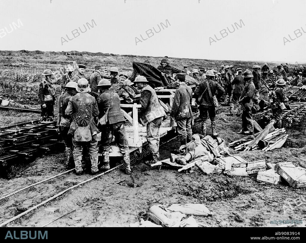 WW1/France: Battle of Vimy Ridge. Canadian and German Red Cross men despatching wounded to a dressing station on a light railway. April 1917.