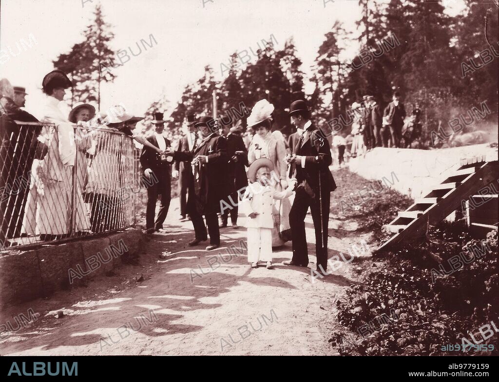 August 1908. Mr. Fallieres in Norway. Cristiania. (1) The President of the French Republic Receiving Gifts from the Public Gathered to Watch Him Pass. (2) Queen Maud, (3) King Haakon, (4) Prince Olof.