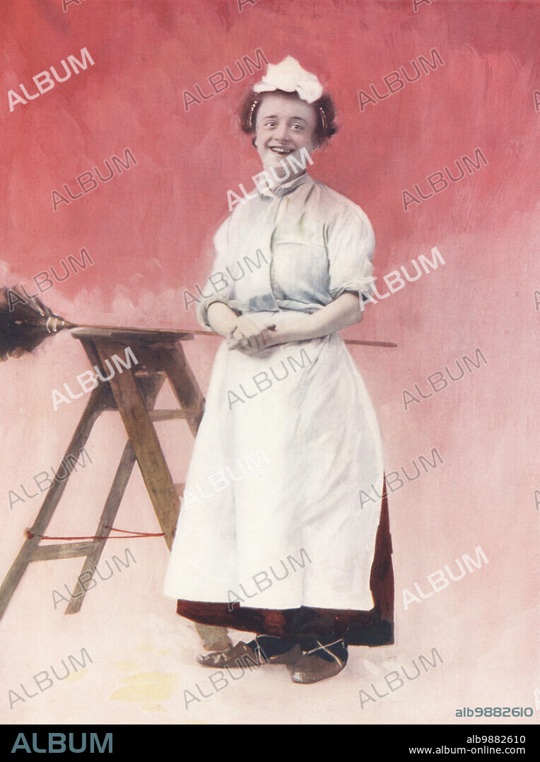 Miss Louie Freear as Flo Honeydew in The Lady Slavey, an operetta based on Cinderella by George Dance and John Crook, Royal Avenue Theatre, 1894. Louisa Freear, English actress, singer and comedienne, 1871-1939. Photograph by Alfred Ellis and Walery (Stanislaw Julian Ignacy). Colour printing of a hand-coloured illustration based on a monochrome photograph from George Newness Players of the Day, London, 1905.