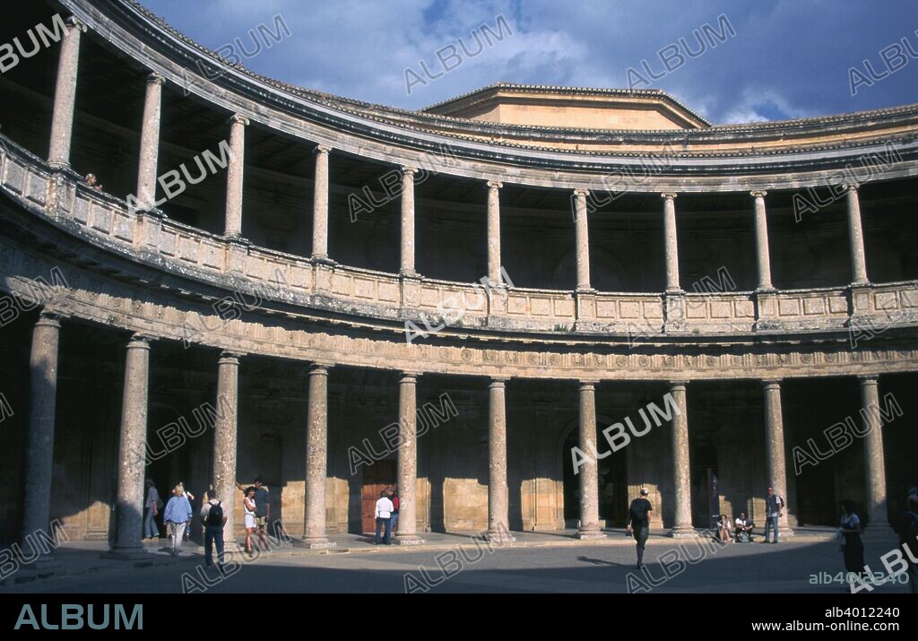 Palace of Charles V, Alhambra, Granada, Andalusia, Spain. In 1526, the Holy Roman Emperor Charles V commissioned Pedro Machuca, a student of Michelangelo, to build him a Renaissance palace within the Moorish fortress of the Alhambra. Although an impressive example of Renaissance architecture in its own right, the resultant building is thought by many to be grossly at odds with the delicate Islamic architecture of the rest of the Alhambra complex.