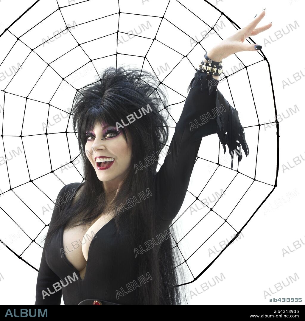 CASSANDRA PETERSON in ELVIRA: MISTRESS OF THE DARK, 1988, directed by JAMES SIGNORELLI. Copyright NBC.