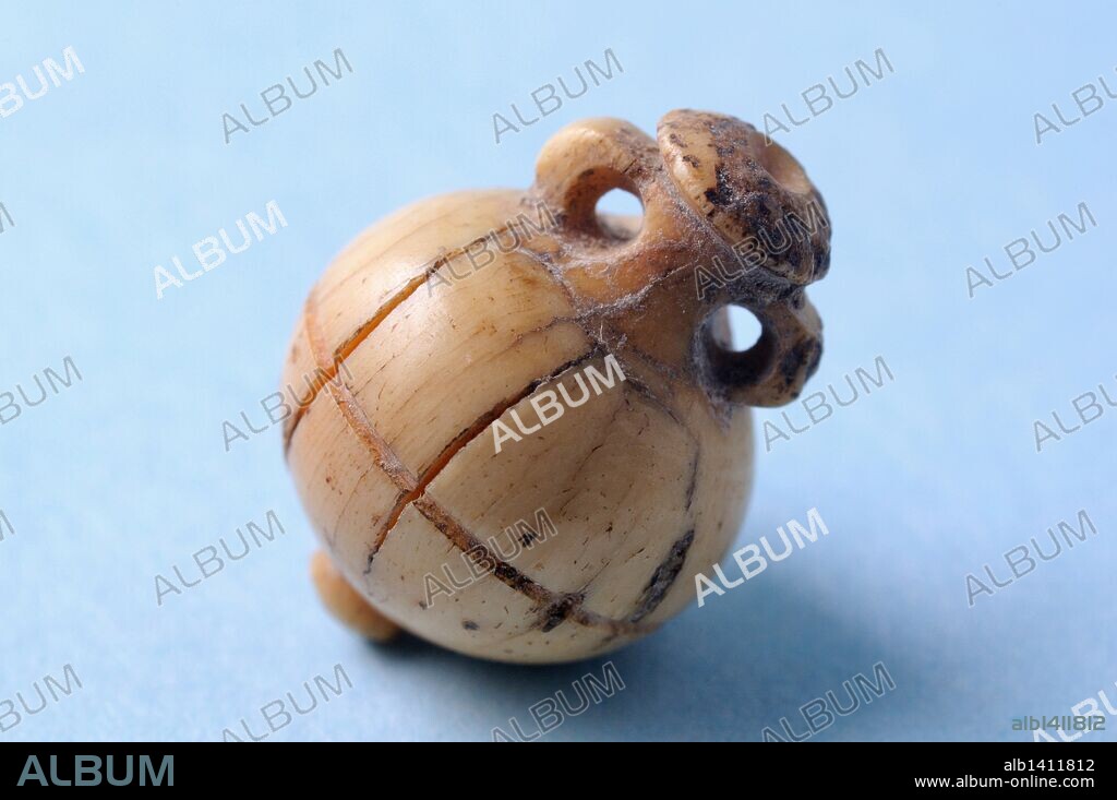 Miniature oil amphora made in ivory, associated with the female private orbit.14 mm ( 3rd CE ) - Roman period, from the " House of Griffins "- Archaeological site of Complutum in Alcalá de Henares (Madrid). SPAIN.