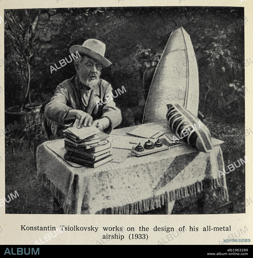 Konstantin Tsiolkovsky works on the design of his all-metal airship (1933.) Russian astrophysicist and rocket pioneer, Photograph. Portrait. Science.