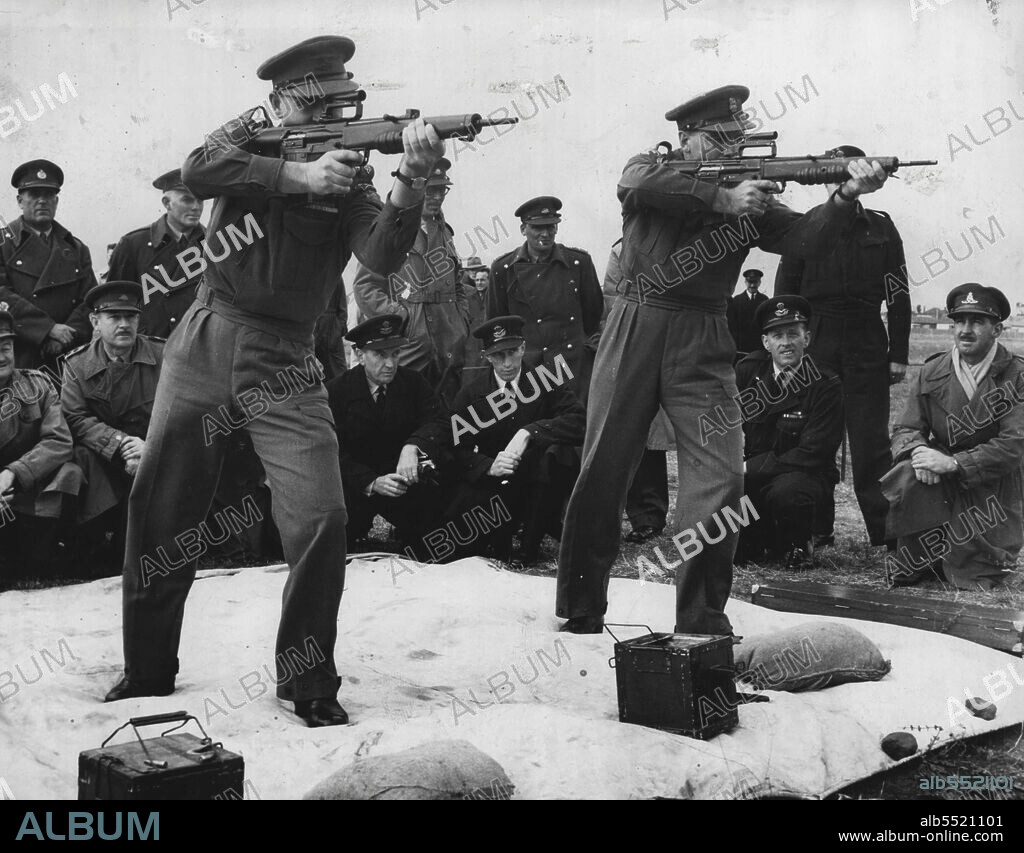 L to R Lt. Col. R Hughes, Col Dr. Jackson ***** new 7 ***** gun at Williamtown. October 5, 1953.