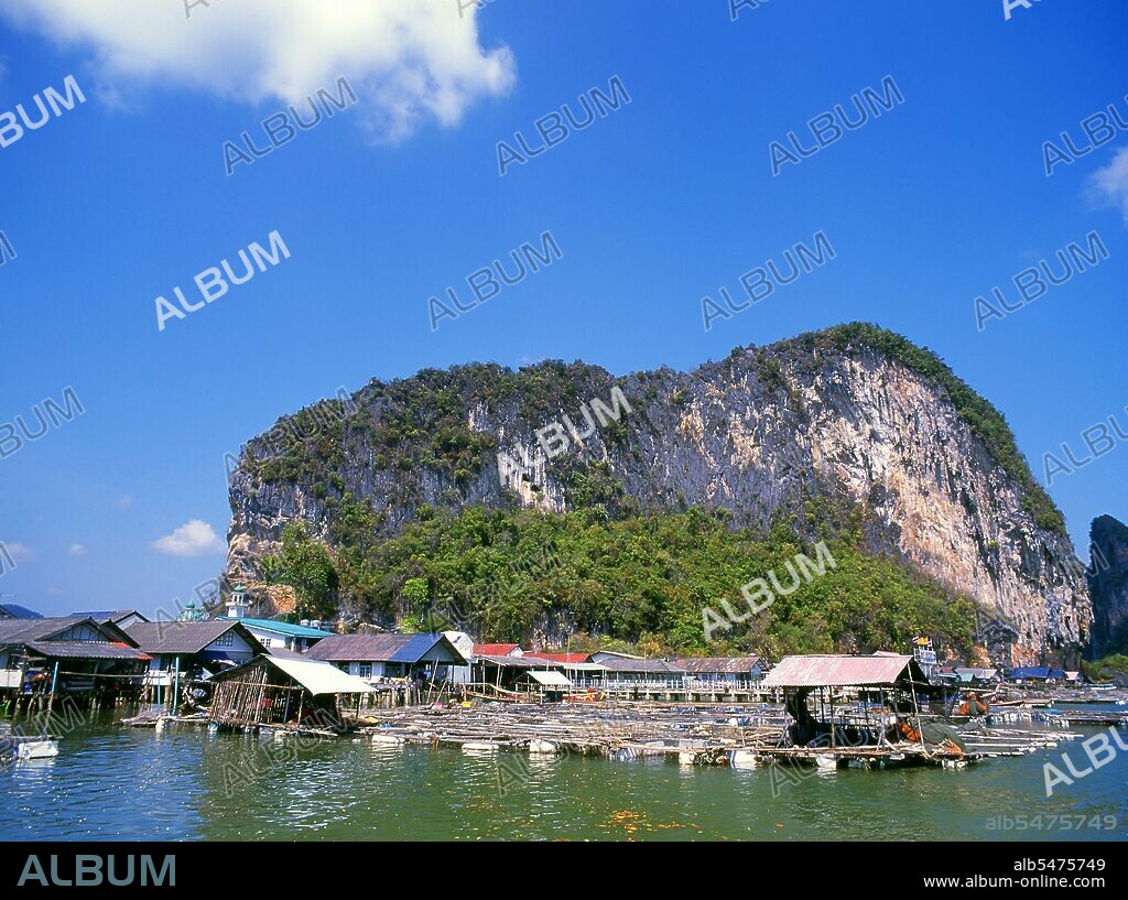 Ko Panyi is a massive karst outcrop in the lee of which a prosperous Thai Muslim fishing village shelters from the South-West Monsoon. The unusual location of the stilted Muslim fishing village, together with the unexpected mosque and minaret, has provided the inhabitants of Ko Panyi with an unexpected and welcome additional source of income in the years since the advent of tourism. Although the island has become commercialised, the people are remarkably open and friendly. Despite the rise of tourism, fishing remains an economic mainstay for the locals. There are also a few halal restaurants and small cafes on the island. First inaugurated in 1981, Ao Phang Nga National Park covers an area of about 400 sq km and is comprised mainly of karst rocks and islands, towering cliffs and the clear waters of the Sea of Phuket. Although home to a wide variety of marine and coastal creatures, including the two-meter long water monitor, most people visit the park to marvel at and sail through and around the many looming karst towers.