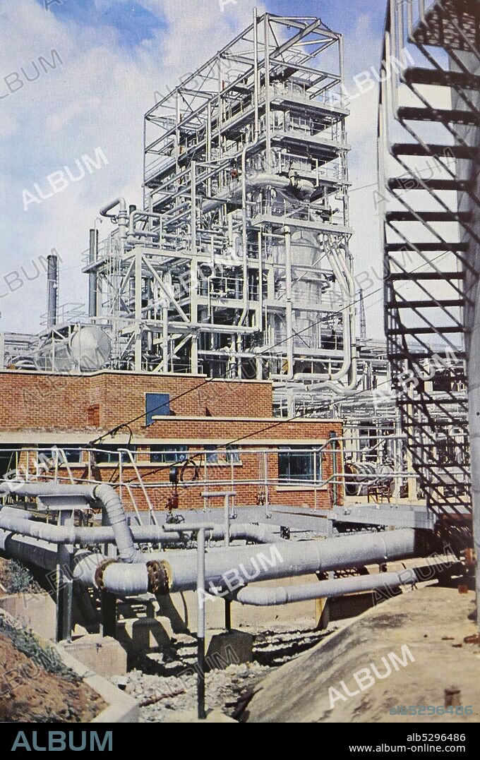 Stanlow oil refinery in Ellesmere Port, North West England, in 1954. Until 2011 it was owned by Royal Dutch Shell. The refinery is situated on the south bank of the Manchester Ship Canal, which is used to transport seaborne oil for refining and chemicals for Esso and Shell.