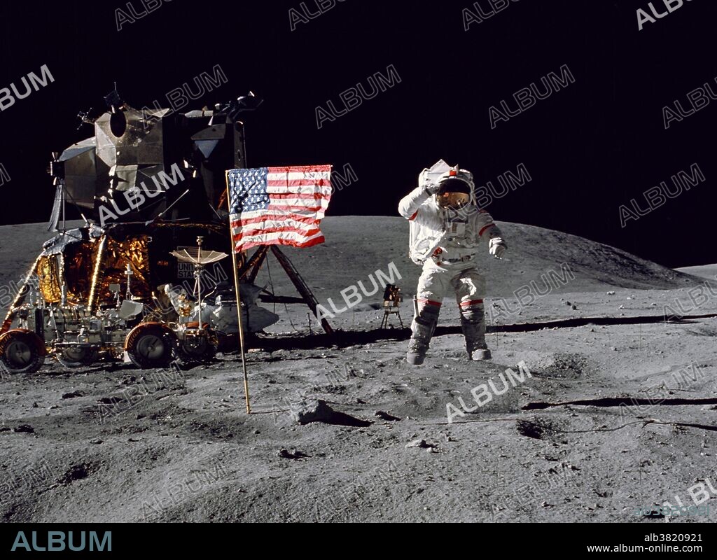 Astronaut John W. Young, commander of the Apollo 16 lunar landing mission, leaps from the lunar surface as he salutes the United States flag at the Descartes landing site during the first Apollo 16 extravehicular activity (EVA) on April 21, 1972. Astronaut Charles M. Duke Jr., lunar module pilot, took this picture. The Lunar Module (LM) "Orion" is on the left. The Lunar Roving Vehicle (LRV) is parked beside the LM. The object behind Young (in the shade of the LM) is the Far Ultraviolet Camera/Spectrograph (FUC/S). Stone Mountain dominates the background in this lunar scene. While astronauts Young and Duke descended in the LM to explore the Descartes highlands landing site on the moon, astronaut Thomas K. Mattingly II, command module pilot, remained with the Command and Service Modules (CSM) "Casper" in lunar orbit.