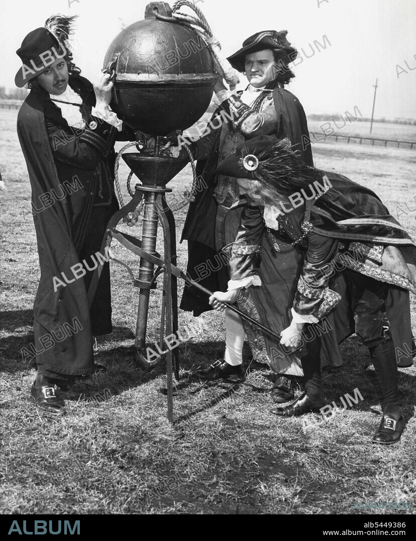 History Under Pressure -- (Fourth Of Six) Otto Von Guericke himself works his air pump to evacuate The air from the Iron Sphere just before the horses try to pull the hemispheres apart. Two teams of eight horses each failed to overcome the outside Air Pressure on the vacuum sphere. This re-enactment for filming took place on a field near Libertyville, Illinois. April 08, 1955. (Photo by United Press).