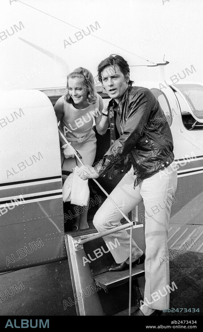 At Nice airport, Alain Delon and Romy Schneider taking a plane to go in Saint Tropez for filming of film LaPiscine, august 12, 1968.