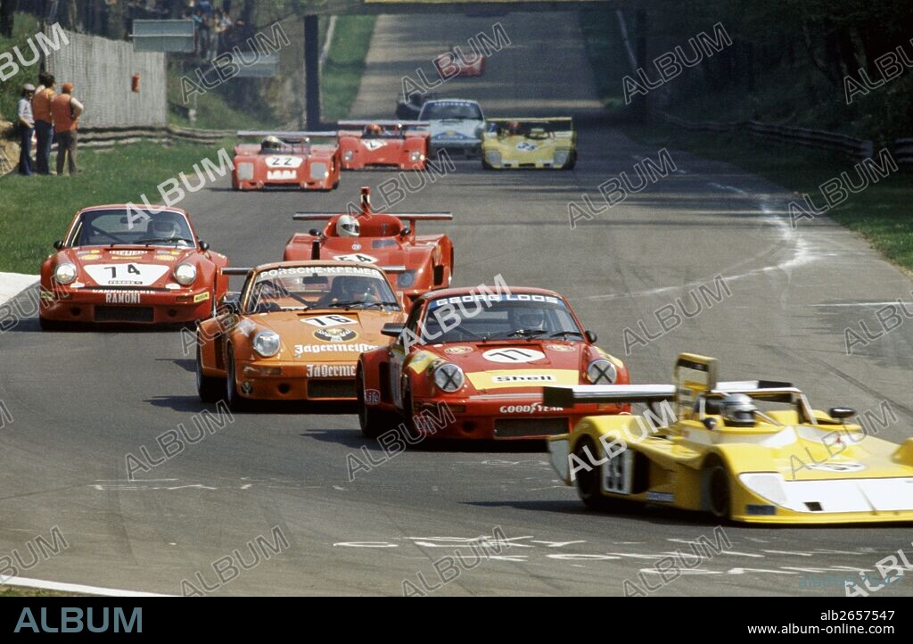 Ascari Chicane, No39 Antonio Castro Prado-Colin Andrews' March 75S Ford, No77 Toine Hezemans-Manfred Schurti-John Fitzpatrick's Porsche Carrera RSR, No 76 Hans Heyer-Helmut Kelleners' Porsche Carrera RSR 911, No74 Claude Haldi-Bernard Beguin's Porsche Carrera RSR 911. Monza 1000KMs race, Italy 1975.