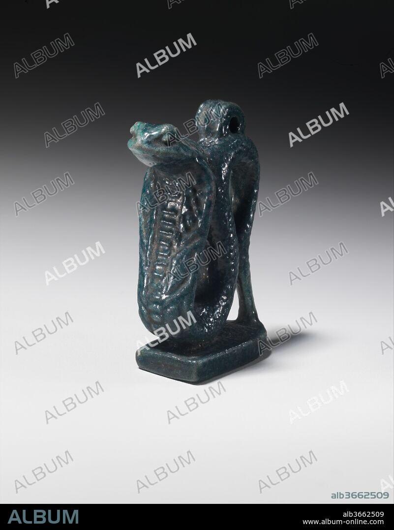 Cobra Amulet. Dimensions: H. 3.8 cm (1 1/2 in.); W. 1.5 cm (9/16 in.); D. 3 cm (1 3/16 in.). Dynasty: Dynasty 26-29. Date: 1070-332 B.C..
The amulet depicts a cobra with a broadened hood and shows very nicely the details of the snake's body. A loop for suspension is at the top.