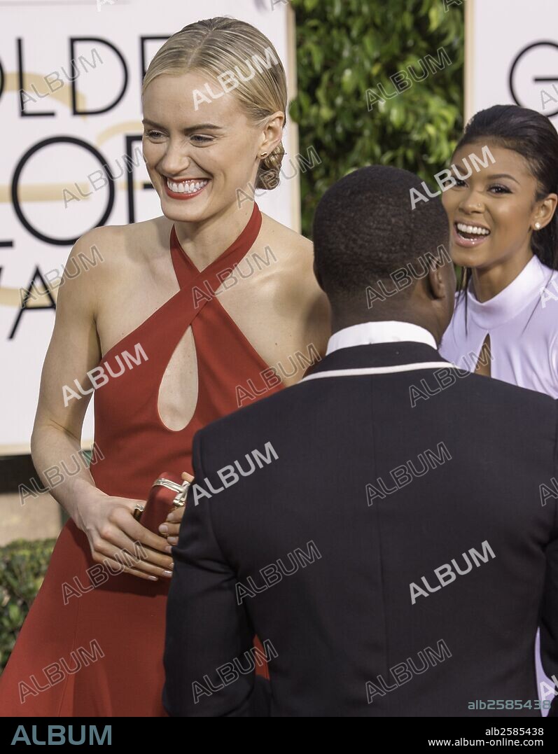Jan. 11, 2015 - Beverly Hills, California, U.S - TAYLOR SCHILLING, left, jokes with ENIKO PARRISH AND KEVIN HART on the red carpet during arrivals for the 72nd Golden Globe Awards. 11/01/2015