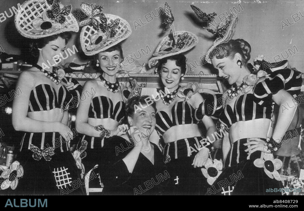 Aria At The 'Copa' -- Helen Traubel, center, red-haired Soprano with the great Wagnerian Operatic voice, makes a final check with other members of the show at her Manhattan opening tonight at Copacabana Club. Girls form left are: Carol Stevens, Rita Prizell, Princess Mayhall and April Kent. Miss Traubel last September refused to sign a new contract with the Metropolitan Opera rather than Knuckle down to a demand that she refrain from Cafe appearances. February 25, 1954. (Photo by AP Wirephoto).