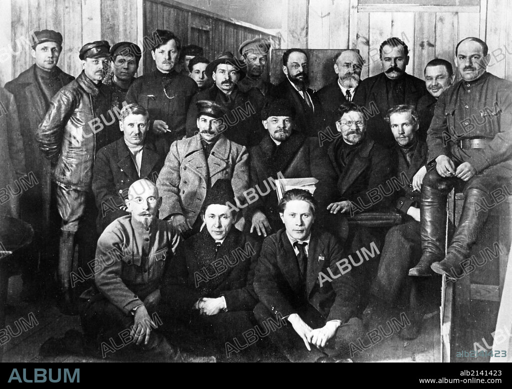 V, i, lenin, m, i, kalinin, i, v, stalin in a group of delegates of the 8th meeting of the bolshevik communist party in moscow, march 1919.