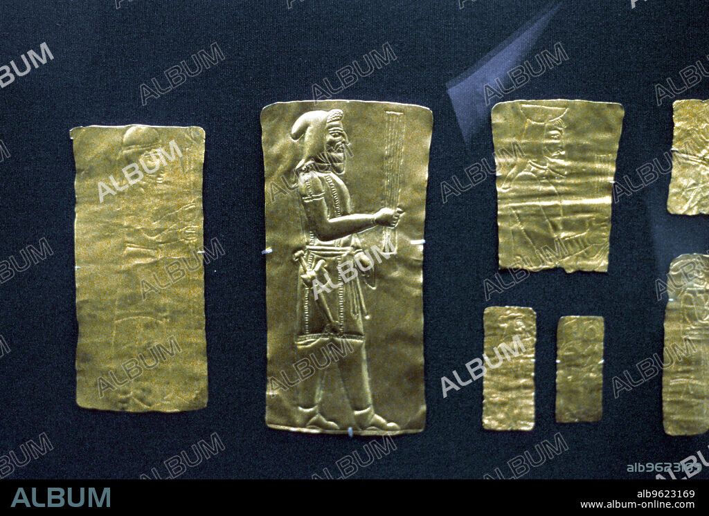 Gold plaques from the Oxus treasure, Achaemenid Persian, 5th-4th century BC. Man wearing Median costume; he has an akinakes (short sword) of a type depicted on reliefs at the Persian centre of Persepolis and represented in the Oxus treasure by a fine gold scabbard. The hooded man is sometimes identified as a priest because he carries a bundle of sticks known as a barsom. These were originally grasses that were distributed during religious ceremonies. The Oxus treasure is the most important collection of silver and gold to have survived from the Achaemenid period. This is one of the finest examples of a group of about fifty thin gold plaques which may have been votive objects left as a pious act in a temple or shrine near the Oxus River at Takht-i Kuwad, Tadjikistan.