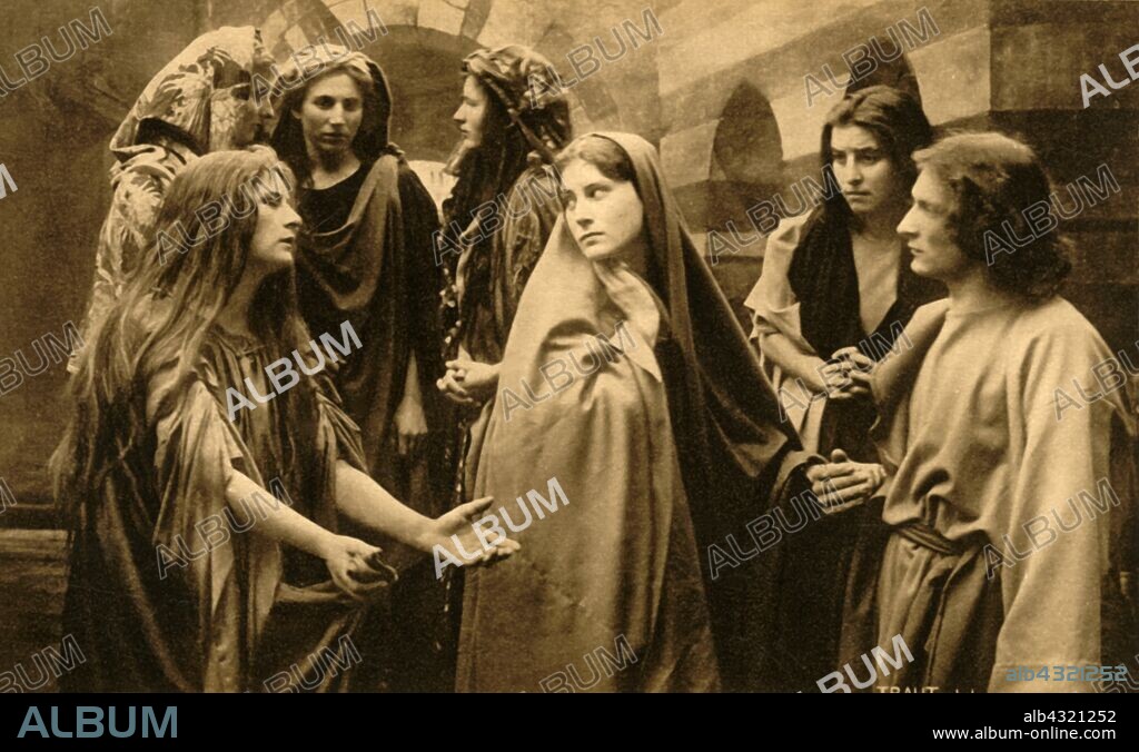 HENRY TRAUT. The wailing women, 1922. Paula Rendl as Mary Magdalene, Martha Veit as the Virgin Mary, Melchior Breitsamter as St John: players in the Oberammergau Passion Play. The play is performed every 10 years, on open-air stages, by the inhabitants of the village of Oberammergau in Bavaria, Germany. First staged in 1634, the play tells the story of Jesus' passion, culminating in his crucifixion. The event has become a tourist attraction, with audiences coming from all over the world. Official postcard of the 1922 Oberammergau Passion Play. [F. Bruckmann, Munich, Germany, 1922].