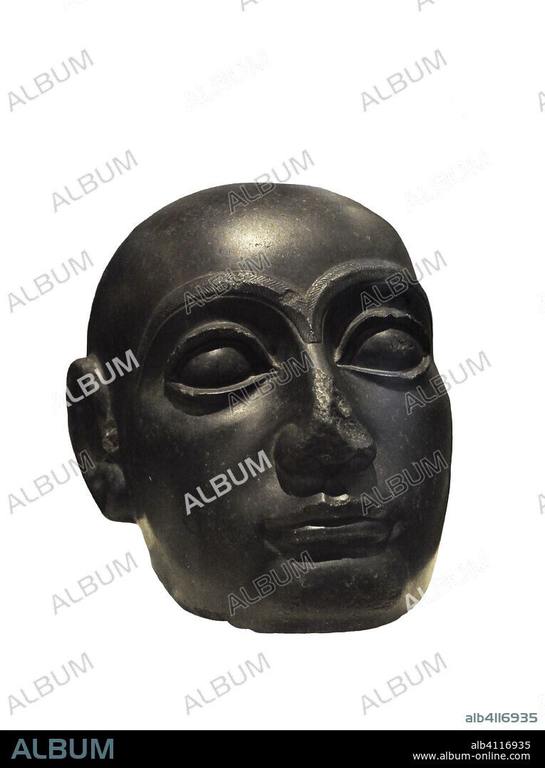 Cabeza de Gudea, príncipe del estado de Lagash, del 2144 a.C. al 2124 a.C. Mesopotamia. Periodo neosumerio. Diorita, 22 x 26 cm. Museo Arqueológico Nacional. Madrid. España. (En depósito, Museo del Prado).