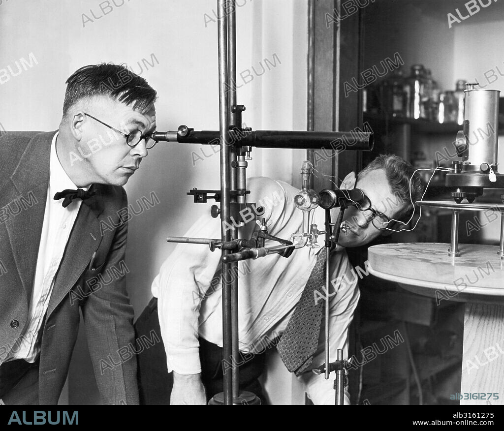 Pasadena, California: c. 1926 Astronomers Edison Pettiy, (L) and Seth Barnes Nicholson of the Mt. Wilson Observatory have made the first systematic infrared observations of celestial objects using a thermocouple and a galvanometer. NIcholson is observing the thermocouple while Pettit watches the galvanometer.