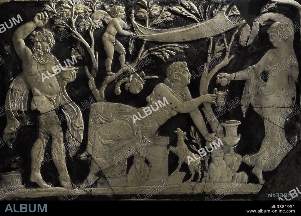 Panel with Maenad pouring wine for Ariadne. Next, a Satyr dancing between trees with objects of the cult of Dionysus. Glass. Cameo. 1st century AD. National Archaeological Museum. Naples. Italy.