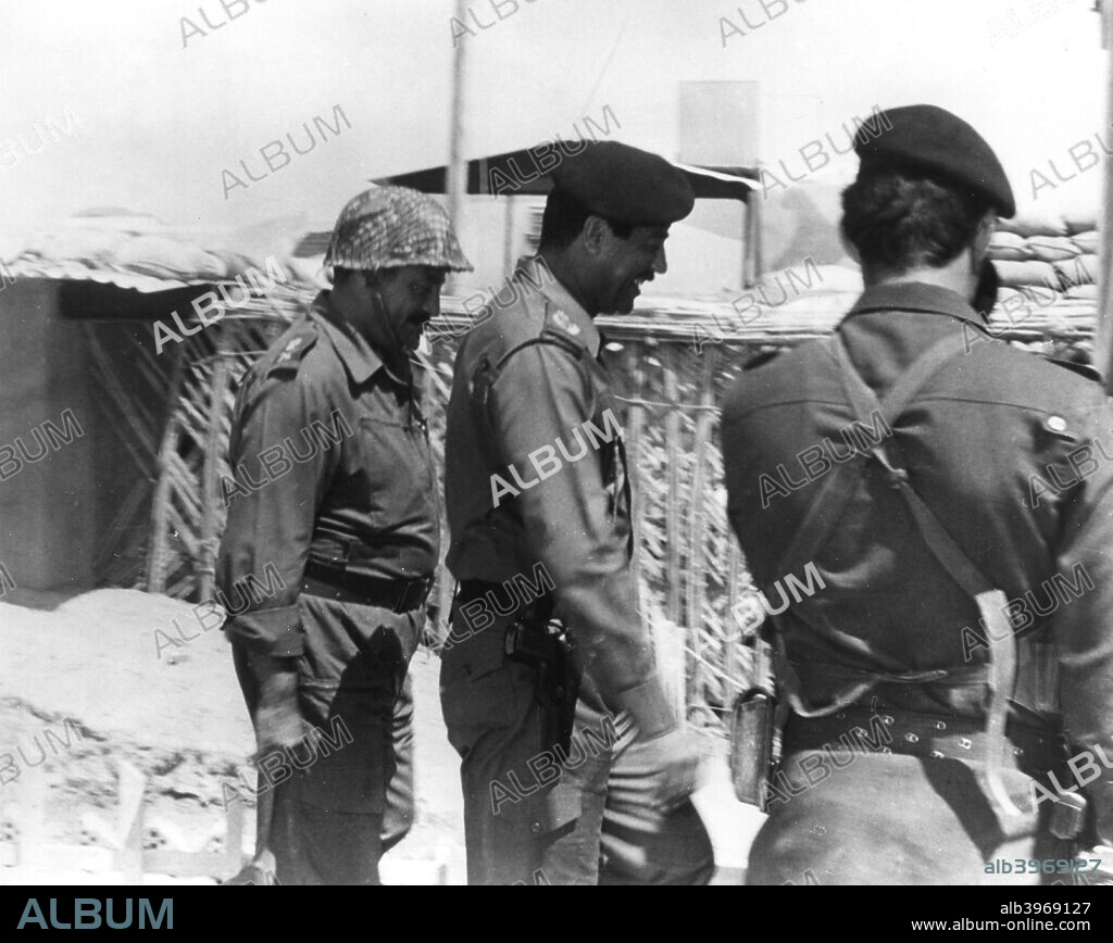 Taha Yassin Ramadan and Saddam Hussein inspecting the Basra front, Iraq, February 1987. The Iraqi President and commander-in-chief accompanied by Taha Yassin Ramadan, the leader of the paramilitary Popular Army, during the Iran-Iraq War. Ramadan went on to become Vice-President of Iraq in 1991 but was tried and executed after the fall of Saddam Hussein's regime.