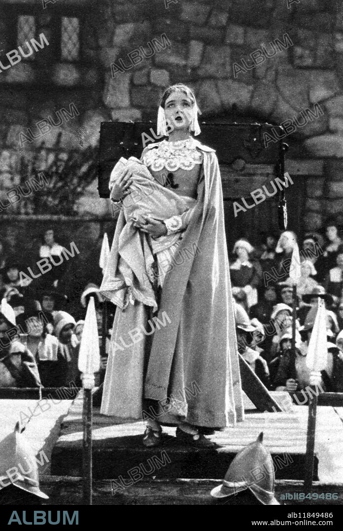 A scene from the film version of The Scarlet Letter : The dramatic climax of The Scarlet Letter where Hester Prynne ( actress Lillian Gish ) with her baby , and the letter A on her breast , standing on the pillory scaffold . 4 December 1926.