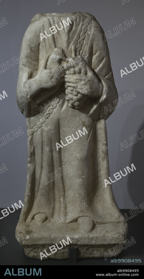Female figure carrying offerings (a bird and grapes). 1st-2nd century AD. Remains of a statue found in the Roman temple of Endovelicus at Sao Miguel da Mota. Terena, Alandroal, Evora. Portugal. National Archaeology Museum. Lisbon, Portugal.