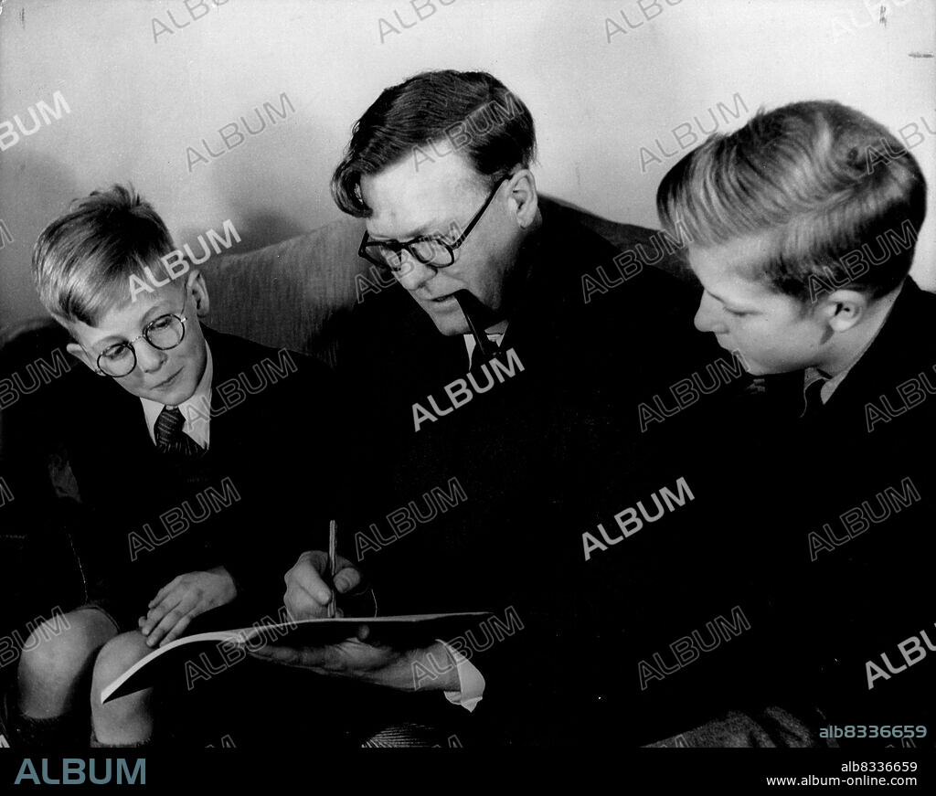 Bill Penney, rated the best atomic mathematician in the world, checks over his 10-year-old son Christopher's first steps in algebra. On right, 14-year-old Martin Penney.Rated the best atomic mathematician in the world, Dr. Penney checks over his 10-year-old son Christopher's first steps into the frustrations of algebra. The other boy is Martin, aged 14. July 2, 1952. (Photo by Tom Blau, Camera Press Ltd.).