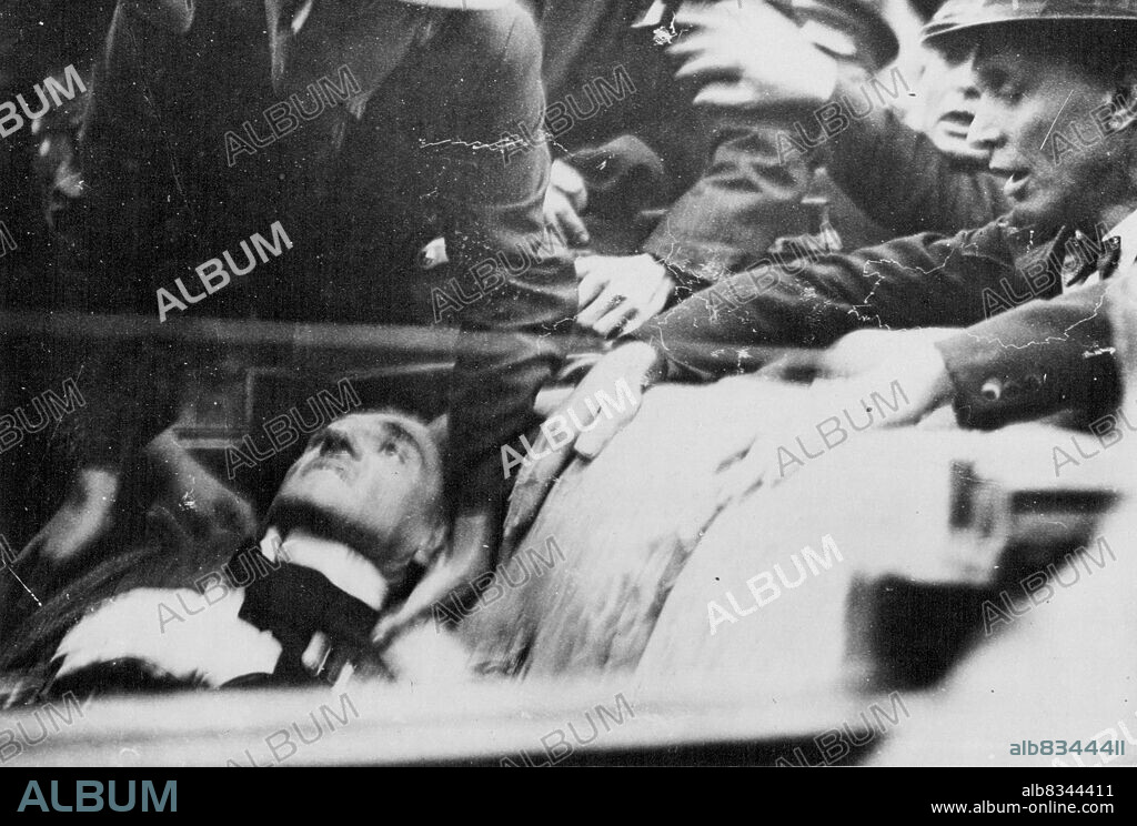 Assassination of King Alexander of Yugoslavia and M. Barthou, French Foreign Minister
King Alexander of Yugoslavia and M. Barthou, the French Foreign Minister, were assassinated at Marseilles last evening. The assassin, a Croat named Petrus Kalermen, was afterwards lynched by the infuriated crowd.
Photo shows: King Alexander of Yugoslavia lying back dying in the car after being fatally shot. October 10, 1934. (Photo by Topical Press).