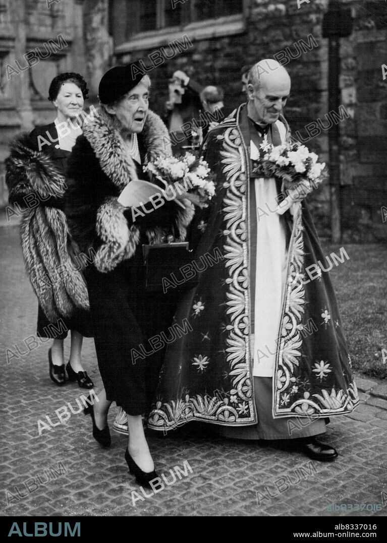 Princess Marie Louise At Maundy Money Service -- Princess Marie Louise, deputising for the Queen mother, accompanied by the Dean of Westminster, Dr. Alan C. Don, at the Royal Maundy service at Westminster Abbey, London, to-day (Maundy Thursday). The Princess distributed the Maundy coins - to every recipient a penny for each year of the Queen's life. The ceremony dates back to the days when the monarch washed the feet of the poor, symbolising Christ's laving of the Apostles' feet. April 15, 1954. (Photo by Reuterphoto).