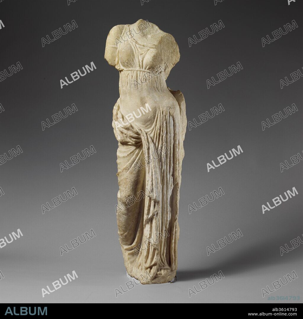Marble statue of Aphrodite. Culture: Greek. Dimensions: H. 32", W. 9 1/2", D. 6 1/2. Date: 2nd century B.C..
The goddess of love stands in an exaggerated hipshot pose. She wears a thin chiton girded just below the breasts, and her himation (cloak), which must have been draped over the missing left arm, falls in thick folds between her legs. This figure is one of the many variants created in the Hellenistic period of a statue type known as the Tiepolo Aphrodite. A major over-life-sized version and numerous statuettes have been found in Athens; many examples also come from the island of Rhodes.