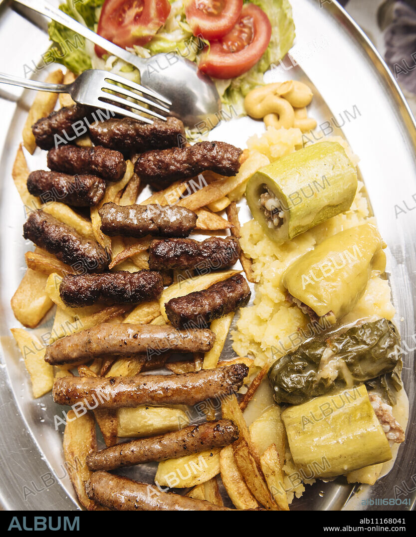 Traditional dish of cevapi and sausages, Mostar, Bosnia and Hercegovina, Europe.