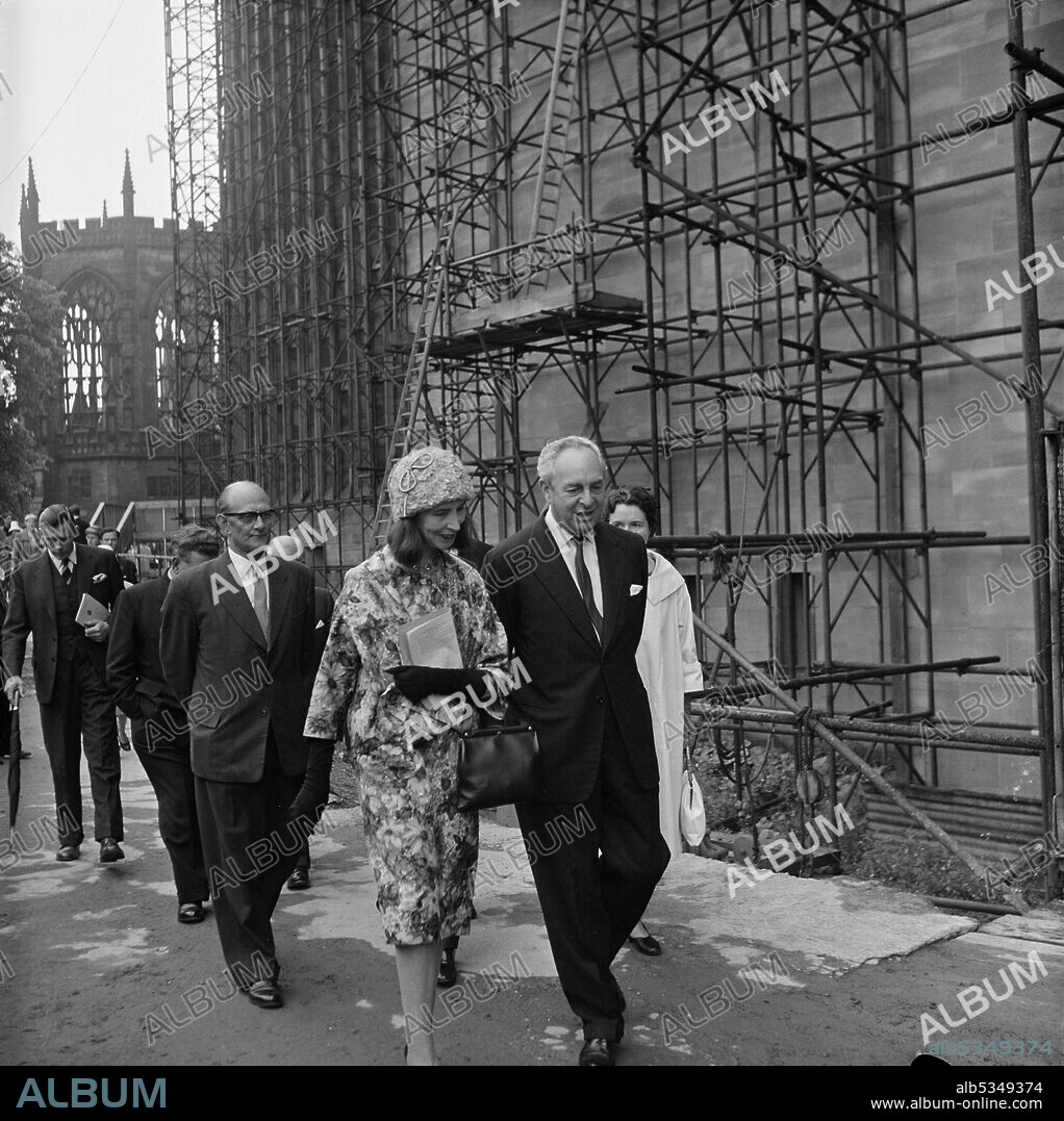 JOHN LAING PLC. Lady Epstein with Sir Fordham Flower at Coventry Cathedral for the unveiling ceremony of the statue St Michael and the Devil by sculptor Jacob Epstein. The statue of the Archangel Michael overcoming the Devil was the last sculpture Sir Jacob Epstein created before he died in 1959. The statue overlooks the steps leading up to the entrance of Coventry Cathedral. The photograph shows his widow Lady Epstein, who unveiled the statue, along with Sir Fordham Flower OBE, the chairman of the Coventry Cathedral Reconstruction Committee.