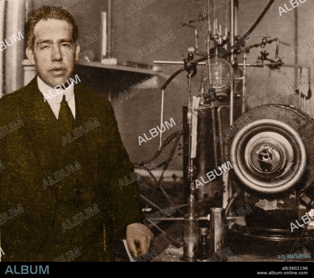 Bohr beside a magnet and gas-discharge apparatus he used to study the properties of atoms in gases, 1922. Niels Henrik David Bohr (October 7, 1885 - November 18, 1962) was a Danish physicist who made foundational contributions to understanding atomic structure and quantum mechanics, for which he received the Nobel Prize in Physics in 1922. Bohr published his model of atomic structure in 1913 wherein he introduced the theory of electrons traveling in orbits around the atom's nucleus, the chemical properties of each element being largely determined by the number of electrons in the outer orbits of its atoms. He also introduced the idea that an electron could drop from a higher-energy orbit to a lower one, in the process emitting a photon (light quantum) of discrete energy. This became a basis for quantum theory. Bohr mentored and collaborated with many of the top physicists of the century at his institute in Copenhagen. He was part of the British team of physicists working on the Manhattan Project where he was known by the name of Nicholas Baker for security reasons. His role on the project was as consultant. Following the war Bohr returned to Copenhagen where he died in 1962 of heart failure.