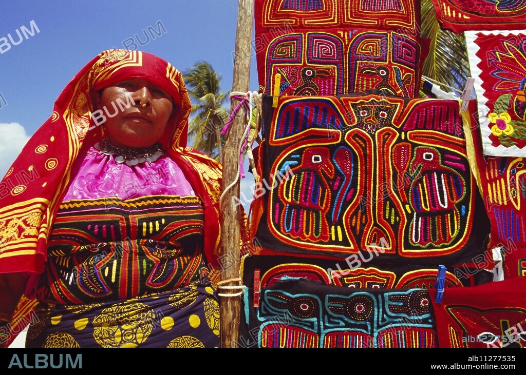 Cuna indian woman displays her molas (traditional garments), San Blas Islands, Panama, Central America.