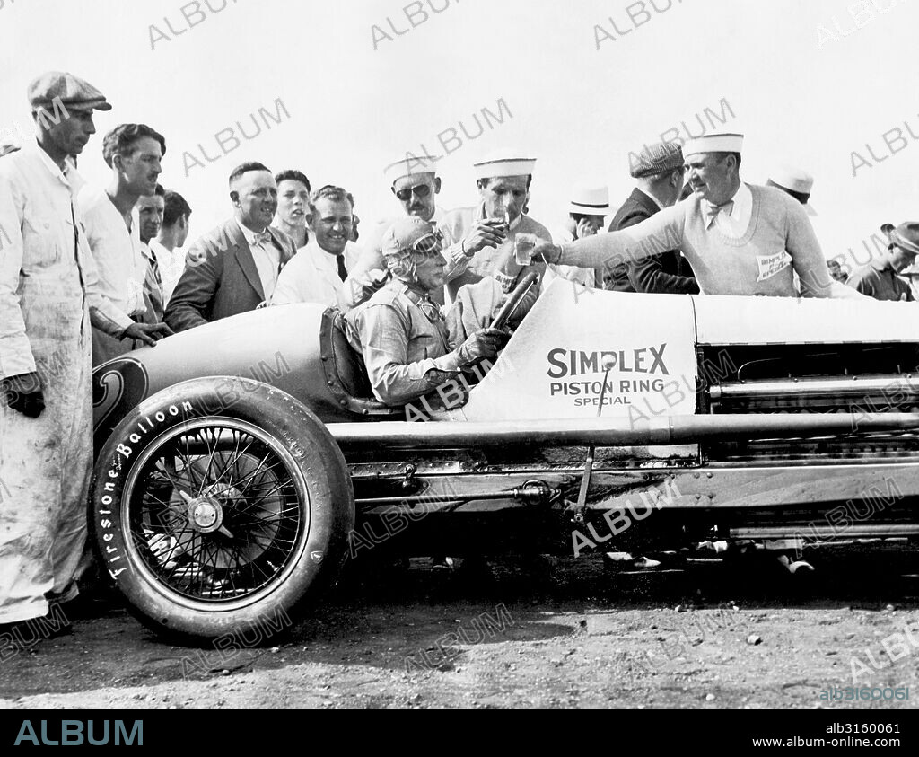 Indianapolis, Indiana: 1929 Race car driver Ray Keech in his Simplex Piston Ring Special #2 race car after winning the Indy 500.