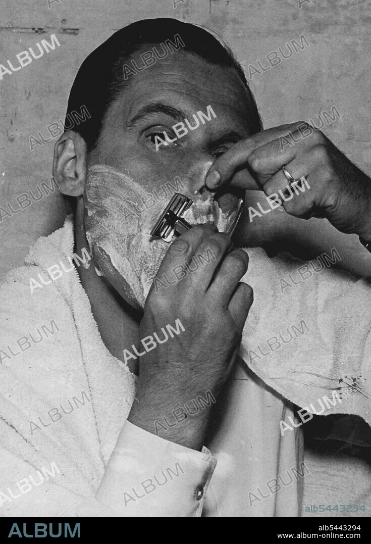 Through The Looking Glass: The Faces That Women - and Men - Make - But of course a man shaving looks just as funny as a woman making-up. Here is Susan Shaw's husband, Albert Lieven. And Men - Make - Have you ever stopped to think what faces are pulled in front of the dressing table mirror? In order to get a little fun out of the serious business of making-up our photographer hid his camera behind a polarised mirror and obtained these unconventional "candid camera" shots of British star Susan Shaw. But man can laugh at their own faces too, which reminds us of the joke "Hallo Mr. Funny Face, how you must enjoy yourself when you shave". August 01, 1950. (Photo by Paul Popper Ltd.).
