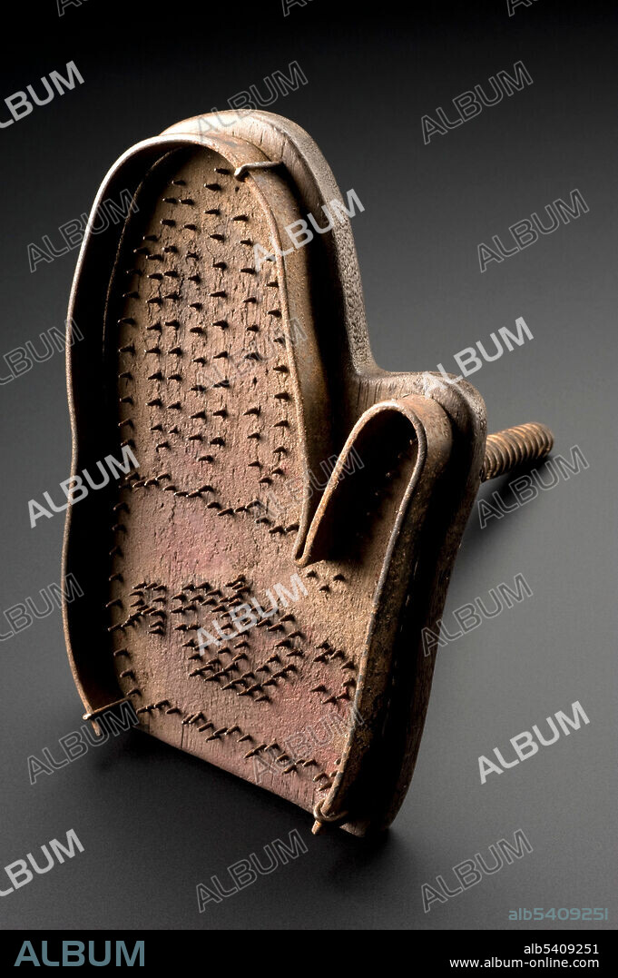 Branding tools were sometimes used to permanently stamp or tattoo army deserters or criminals. This hand-shaped example was made by the British Army during the English Civil War (1641-1651). The branding tool bears the initials ‘CR’ surrounding a crown. This is presumed to refer to ‘Carolus Rex’ - King Charles I. This tool would have been used to mark ‘ownership’ of Royalist army deserters. The metal spikes on the hand are blunt. Perhaps they are dulled through use or perhaps it is deliberate to inflict more pain. However, they were likely heated first to burn the imprint in. Branding was abolished in 1829 for all, with the exception of army deserters. The mark was then tattooed on the body, not branded with irons. The practice was totally abandoned in 1879. Supplied by the Science Museum, London, courtesy of Wellcome Images.