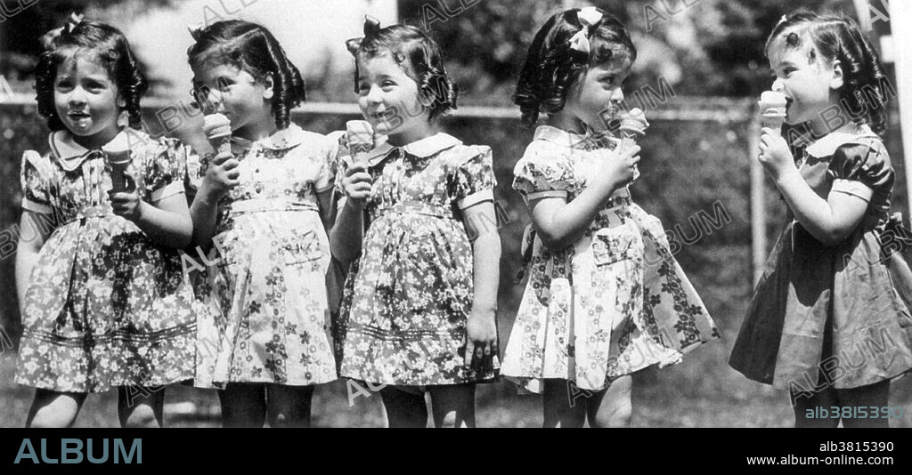The Dionne Quintuplets (born May 28, 1934) are the first quintuplets known to have survived their infancy. The identical sisters were born in Canada. The Dionne girls were born two months premature. After four months with their family, they were made Wards of the King for the next nine years under the Dionne Quintuplets' Guardianship Act, 1935. The government and those around them began to profit by making them a significant tourist attraction in Ontario. The identical quintuplet sisters were, in order of birth: Yvonne Ã‰douilda Marie Dionne (died 2001), Annette Lillianne Marie Allard (living), CÃ©cile Marie Ã‰milda Langlois (living), Ã‰milie Marie Jeanne Dionne (died 1954), Marie Reine Alma Houle (died 1970). No photographer credited, undated.