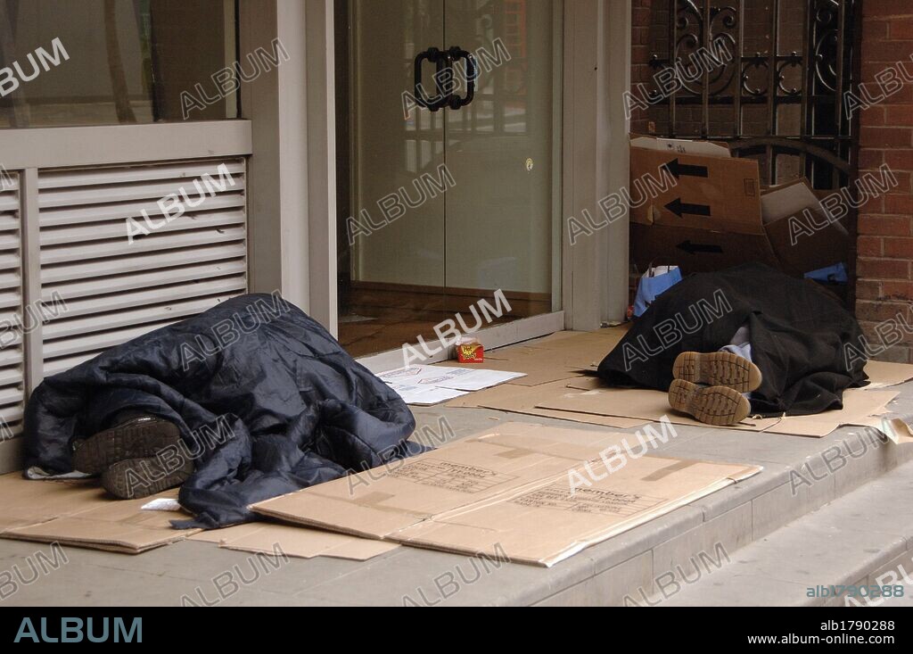 United Kingdom. London. Homeless sleeping in the doorway of a building.