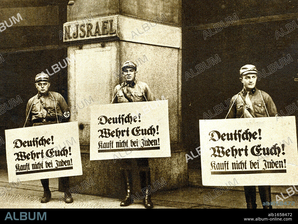 Anti-semitism in Germany, 1933. Nazi pickets outside a Jewish-owned store carrying plackards which read Germans Take Care Do not buy from Jews.