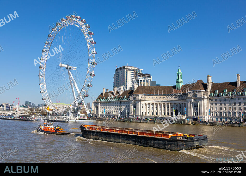 London Eye, tug boat and barge, River Thames, London, England, United Kingdom, Europe.