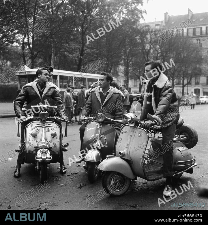 Transport:. Scooterr. The "Blousons noirs" on their scooters on the streets of Paris. Photo, 1965. From a series: Street scenes with young people.