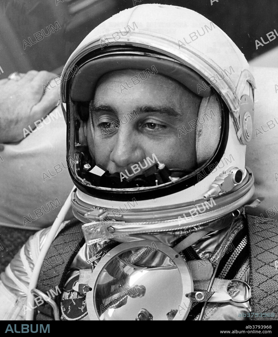 Awaiting orders to proceed to the launch site for Project Mercury's second attempt to launch a man into space, astronaut Virgil I. "Gus" Grissom relaxes in the Personal Equipment Room Hangar "S," Cape Canaveral, Fla. A parabolic Plexiglas mirror on his chest reflects the faces of two fellow Mercury pilots: Walter M. Schirra (left) and M. Scott Carpenter. (See the full resolution image.) The mirror, which was not included in the May 5 Shepard flight, will be used to reflect the instrument panel, bringing it into view of the pilot observer camera. MR-4 has rescheduled for Friday, July 21, 1961. The Liberty Bell 7 spacecraft, which carried Grissom 118 miles into space, carried a variety of instruments designed to record the pilot's every move during the flight for analysis by scientists after the flight. Unfortunately, the spacecraft sank shortly after Grissom exited the craft and was not recovered at that time. Almost 38 years to the day since it sank, the craft was recovered on July 20, 1999. The capsule was "found at a depth of more than 15,000 feet -- 3,000 feet deeper than the wreck of the Titanic.".