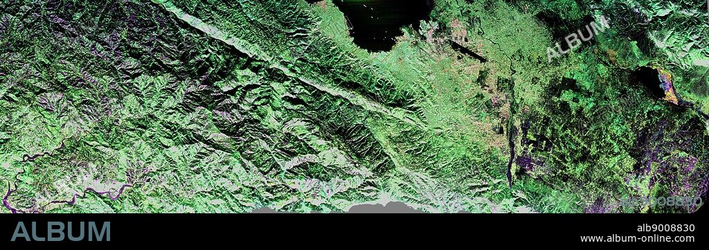 NASA's Uninhabited Aerial Vehicle Synthetic Aperture Radar (UAVSAR) captured this false-colour composite image of the city of Port-au-Prince, Haiti, and the surrounding region on Jan. 27, 2010. Port-au-Prince is visible near the centre of the image (denoted by the yellow arrow on the annotated image above). The large dark line running east-west near the city is the main airport. UAVSAR left NASA's Dryden Flight Research Centre in Edwards, Calif., Jan. 25, 2010, aboard a modified NASA Gulfstream III aircraft on a three-week campaign that will also take it to Central America.
