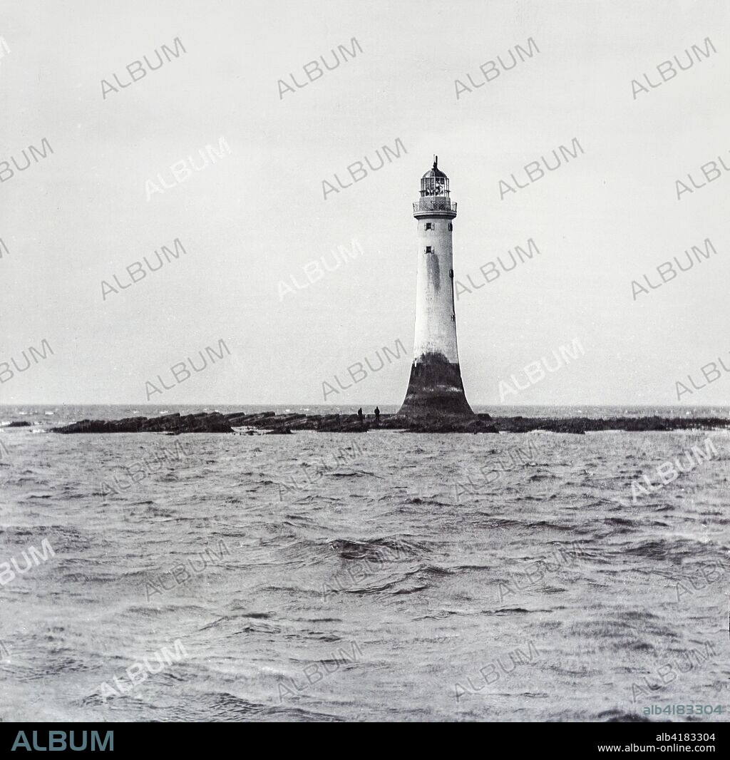 Bell Rock Lighthouse, off the coast of Angus, Scotland, is the world's oldest surviving sea-washed lighthouse. Magic lantern slide circa 1900; Angus, Scotland.