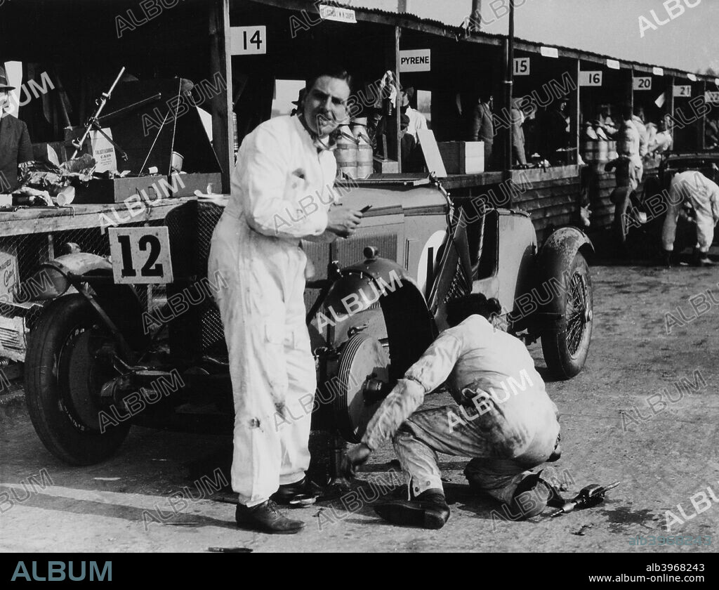 Owen Saunders-Davies and Bill Craig during the Double Twelve Hour Race, Brooklands, Surrey 1931. Tyre change in the pits. Driving a Talbot, they finished the race in 20th place.